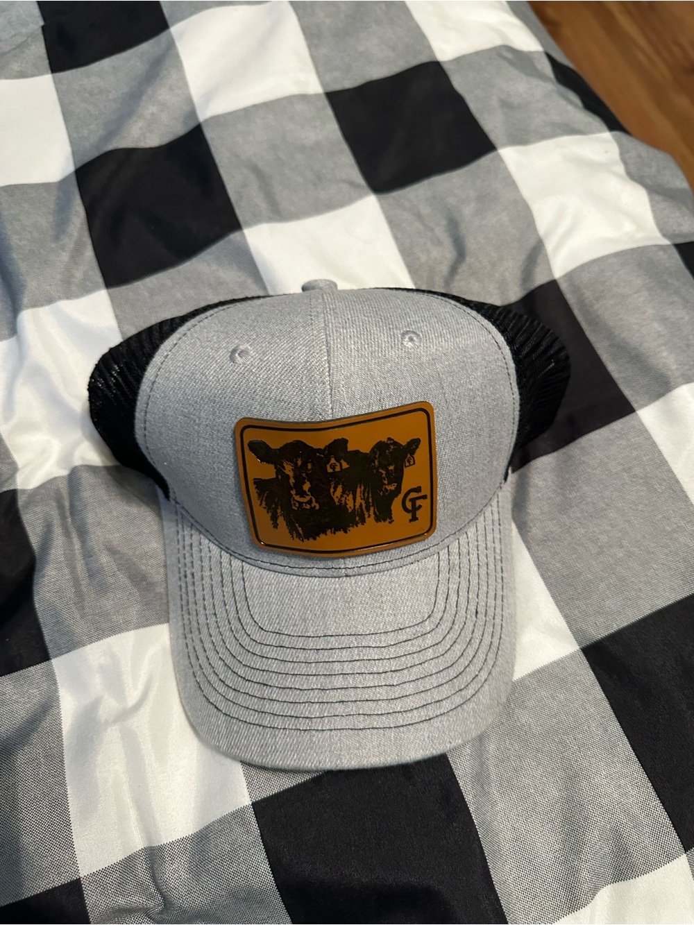 Gray and Black Trucker Hat with Cow Patch